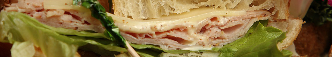 Eating Sandwich Cheesesteak at Taste Of Philly restaurant in Loveland, CO.